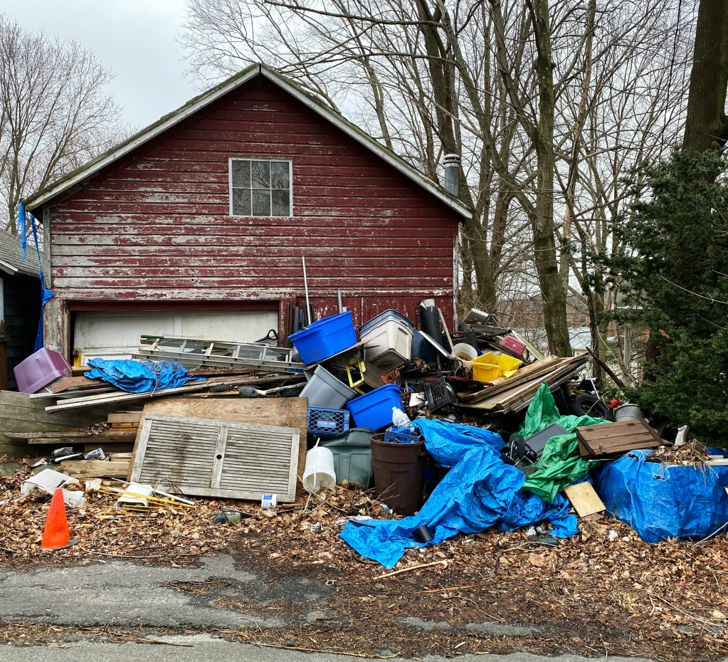 Home covered in garbage and junk